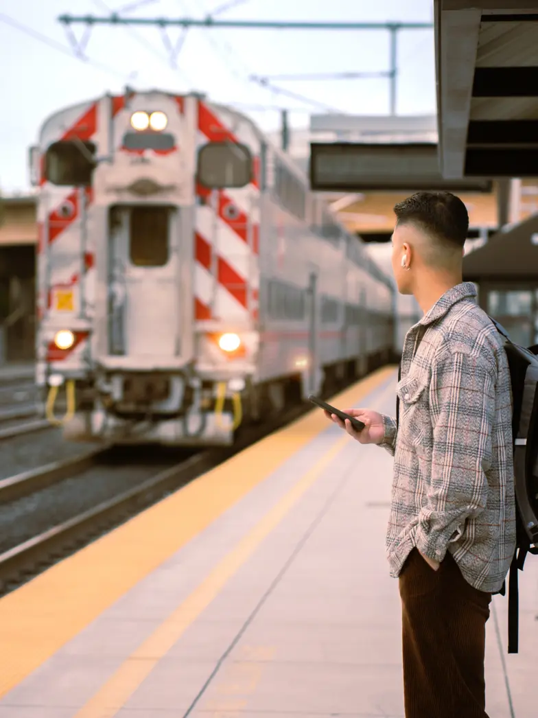 Man Waiting on Caltrain Platform as Train Arrives San Francisco | Brand New Luxury Apartments